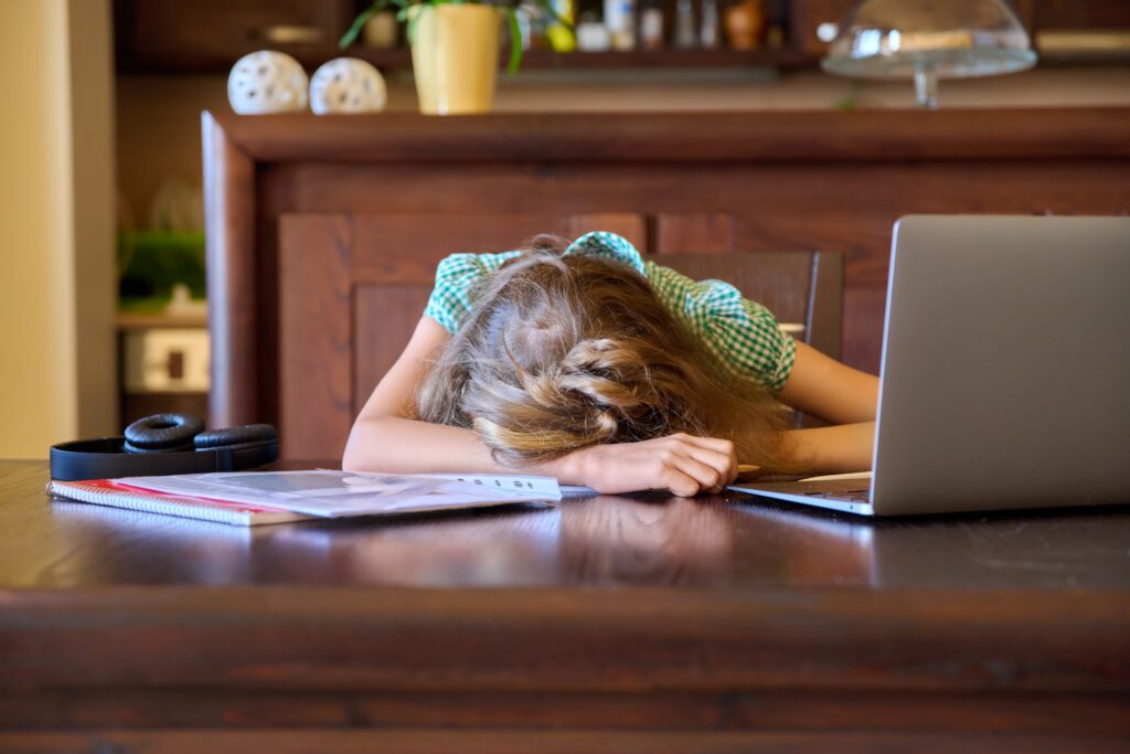 Teen reviewing quiz mistakes with a tutor online