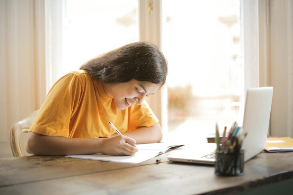 Teen student building writing confidence through journaling at home